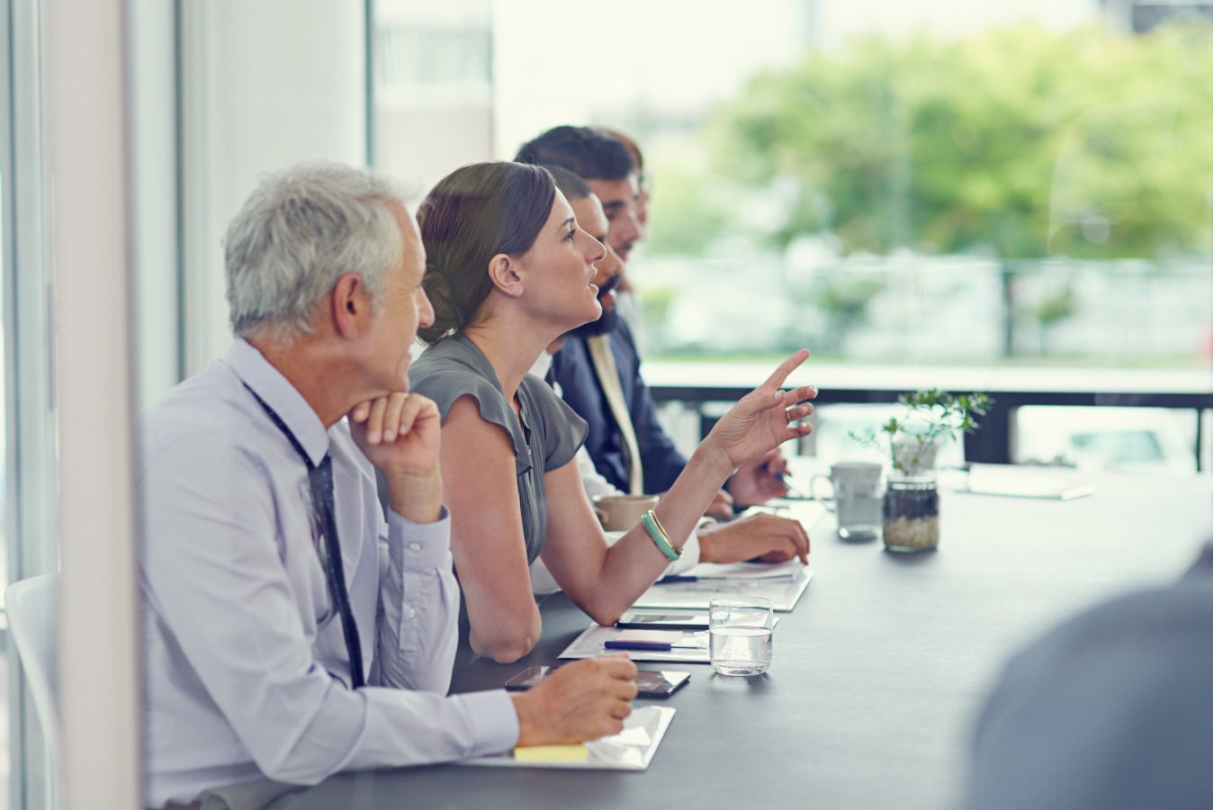 Senior outsourced DPO discussion in a meeting room
