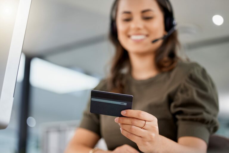 Call centre colleague handling payment support, illustrating digital service and payment-route governance.