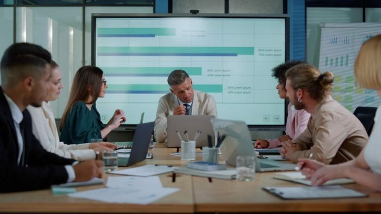 Professionals discussing AI governance data for an internal register and technical documentation review.