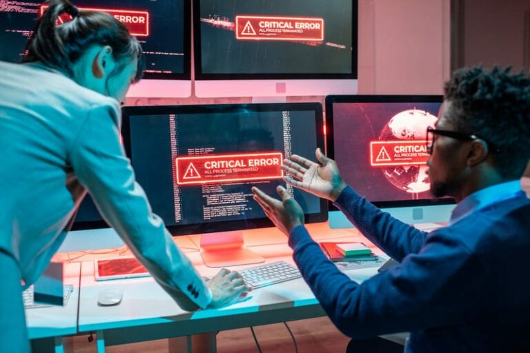 Software engineers reviewing a critical system error as part of cloud AI incident logging and ownership.
