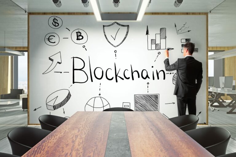 Presenter explaining blockchain technology to colleagues in a modern boardroom.