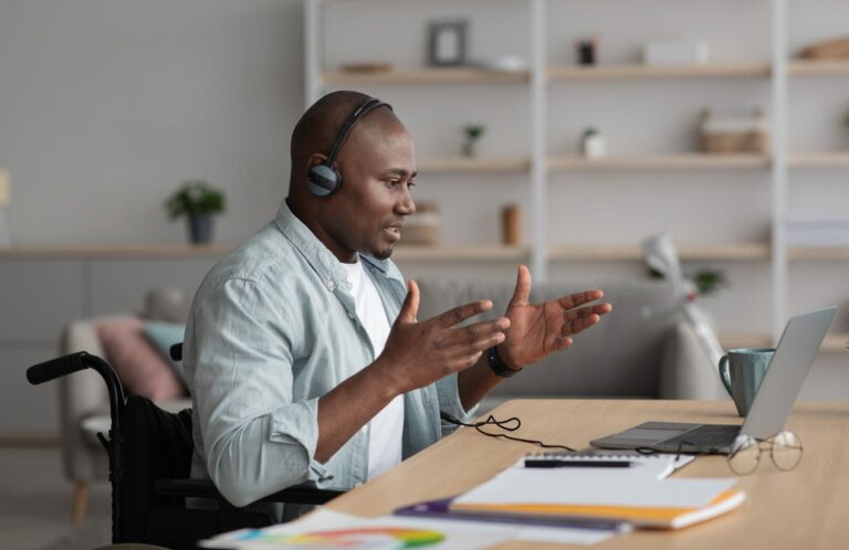 Remote support consultation on a laptop, illustrating proportionate support information and fair service delivery.