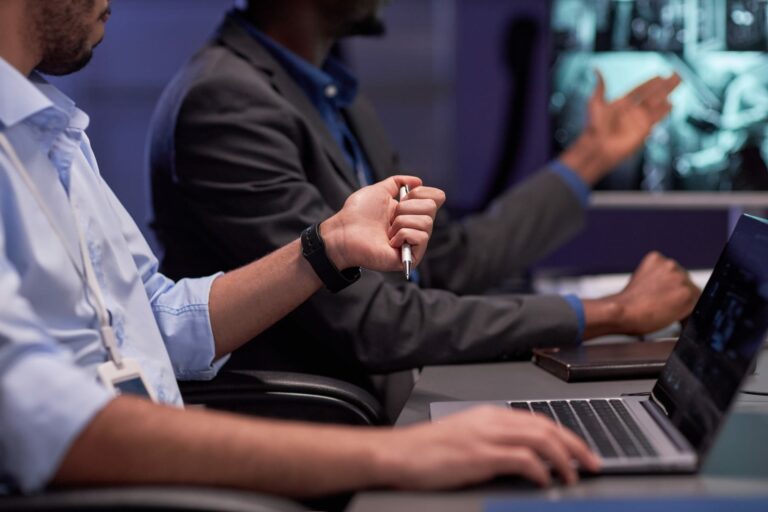 Privacy, legal and security colleagues reviewing a data breach evidence timeline on a laptop.