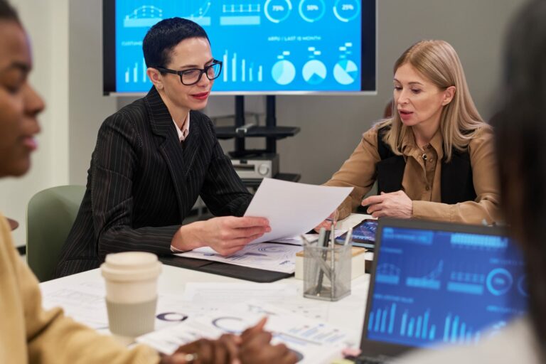 Privacy and governance team reviewing AI recruitment bias audit evidence and subgroup pass-rate results.