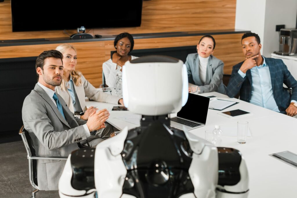 Service robot taking part in a governance meeting with workplace leaders