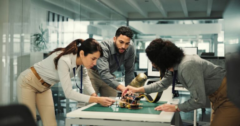 Cross-functional team reviewing a robotics system and its operational evidence