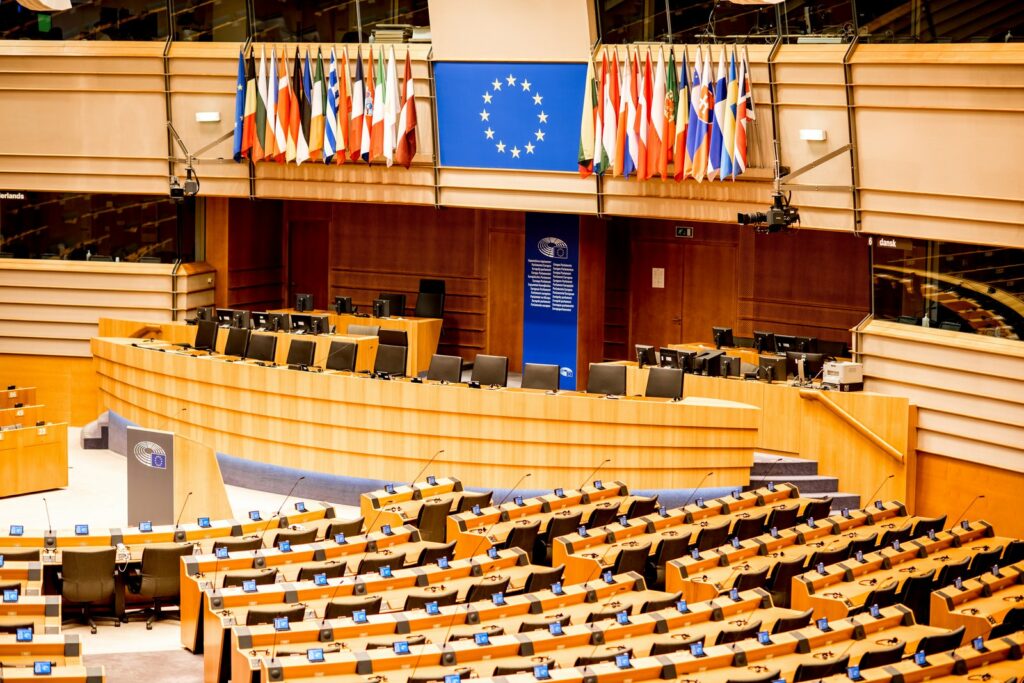 European Parliament chamber illustrating connected data protection and artificial intelligence governance responsibilities